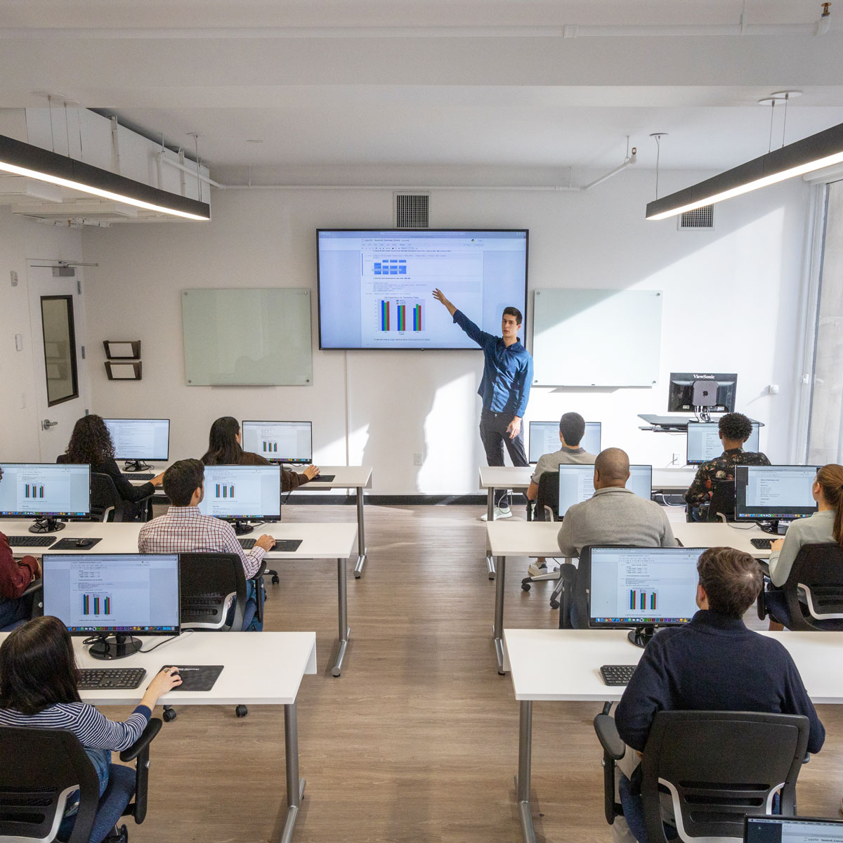 Instructor pointing at projector screen